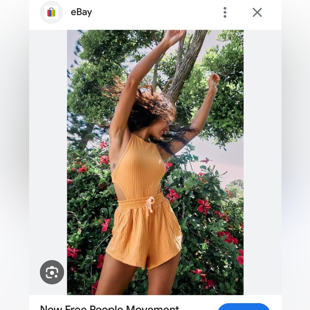 Free people movement Blissed out romper in orange size small